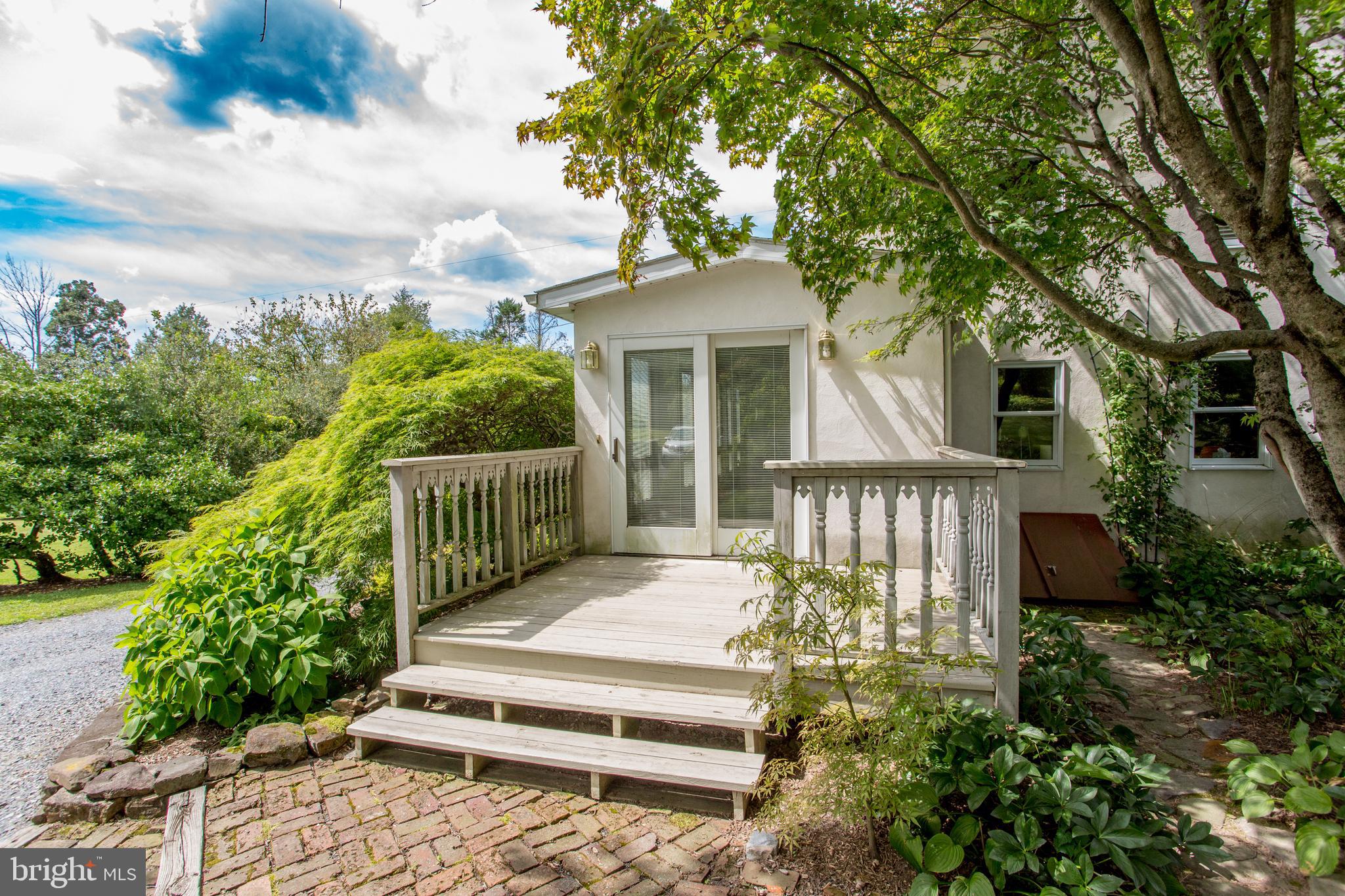 3416 Bursonville Road Riegelsville, PA 18077 - Photo 9 of 69 a view of a house with a small yard plants and large tree
