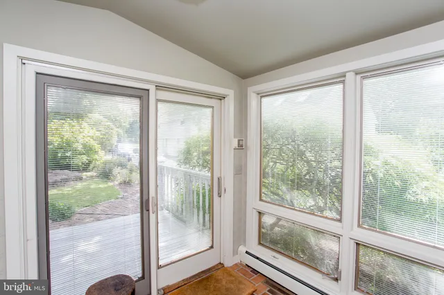 a view of a livingroom with a table and a window