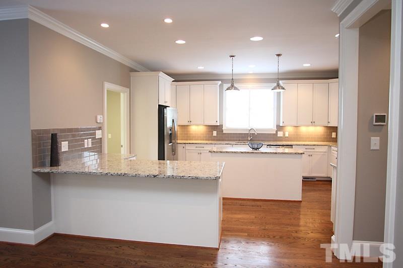 508 Mial Street Raleigh, NC 27608 - Photo 12 of 25 Another view of the kitchen. Sit at the peninsula for casual dining and enjoying time with the chef. Great counter space throughout the kitchen.
