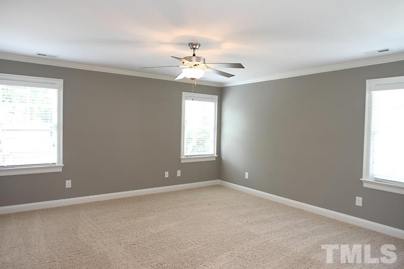 508 Mial Street Raleigh, NC 27608 - Photo 15 of 25 The large master bedroom has an upgraded fan, huge walk in closet plus an additional closet and spa-like master bath.