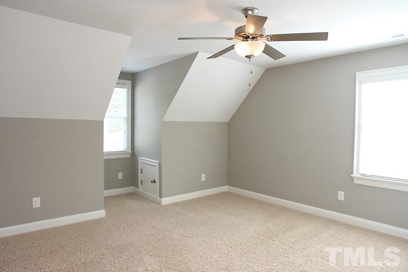 508 Mial Street Raleigh, NC 27608 - Photo 20 of 25 This bedroom has a fan and eave storage as well as a large closet.
