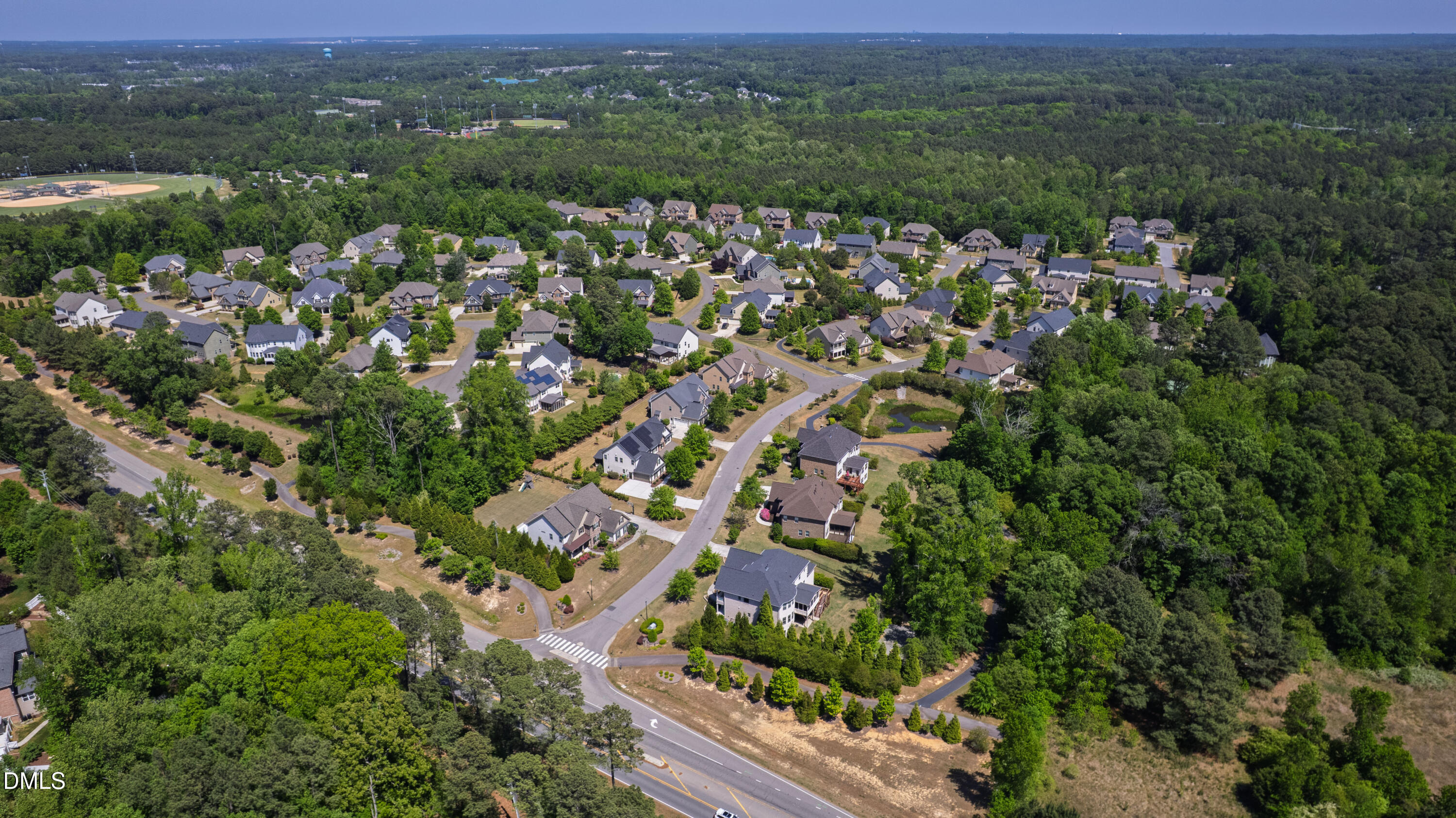 313 Karpen Lane Cary, NC 27519 - Photo 83 of 86 an aerial view of residential houses with outdoor space and trees