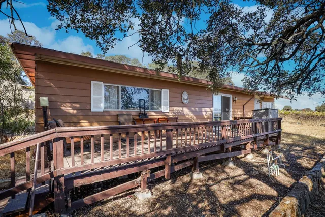 a kitchen with cabinets appliances a sink and a counter top