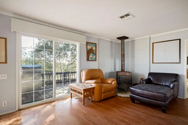 a spacious bedroom with a bed and a window