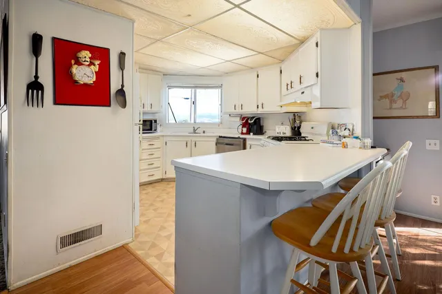 a bathroom with a sink double vanity and a mirror