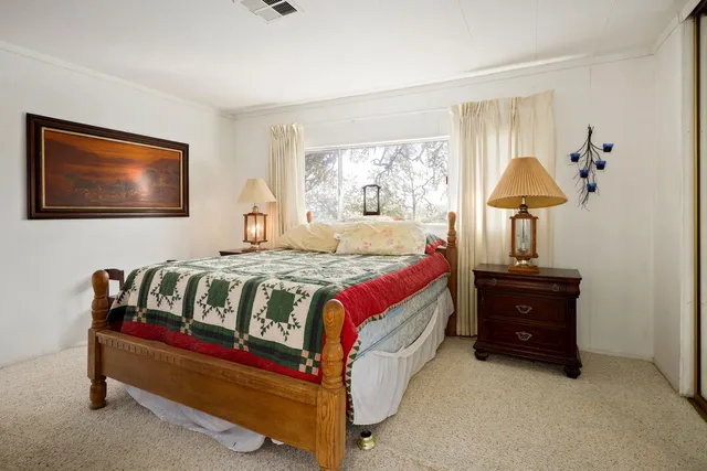 a bathroom with a toilet a sink and a mirror
