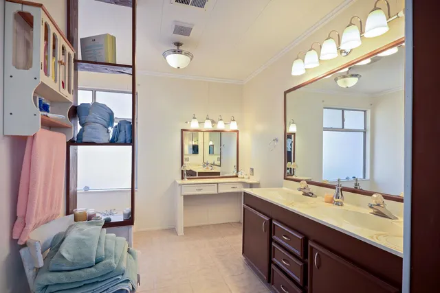 a view of a balcony with furniture and wooden floor