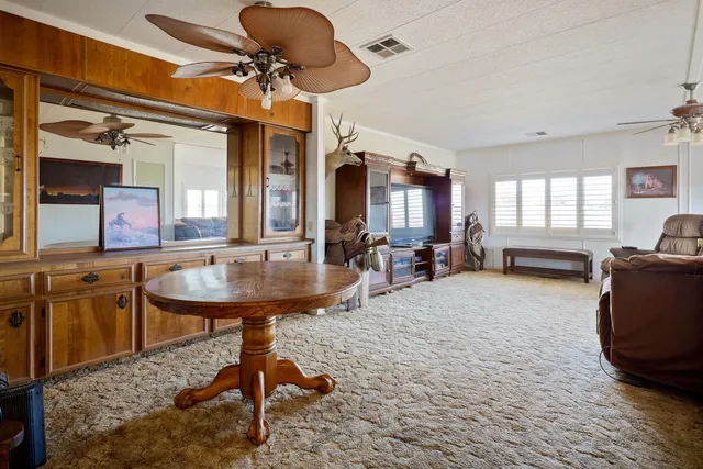 a view of a chairs room with a table and chairs