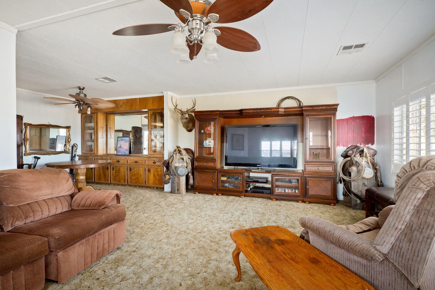 7080 Gwin Street Valley Springs, CA 95252 - Photo 33 of 96 a living room with furniture and a flat screen tv