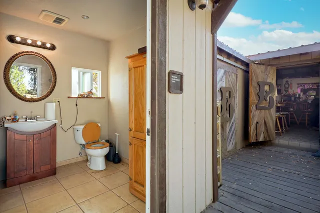 a backyard of a house with table and chairs