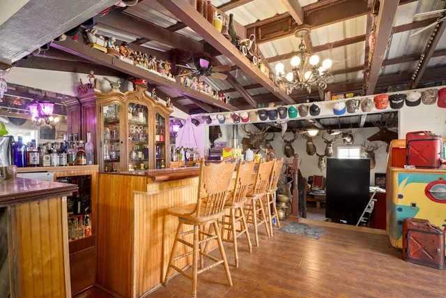 an aerial view of a house with a yard from balcony