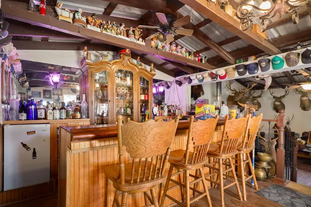 a view of a wooden house with a chairs