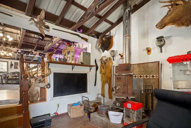 a view of a house with a yard and furniture