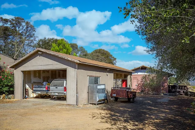 a kitchen with cabinets appliances and a window