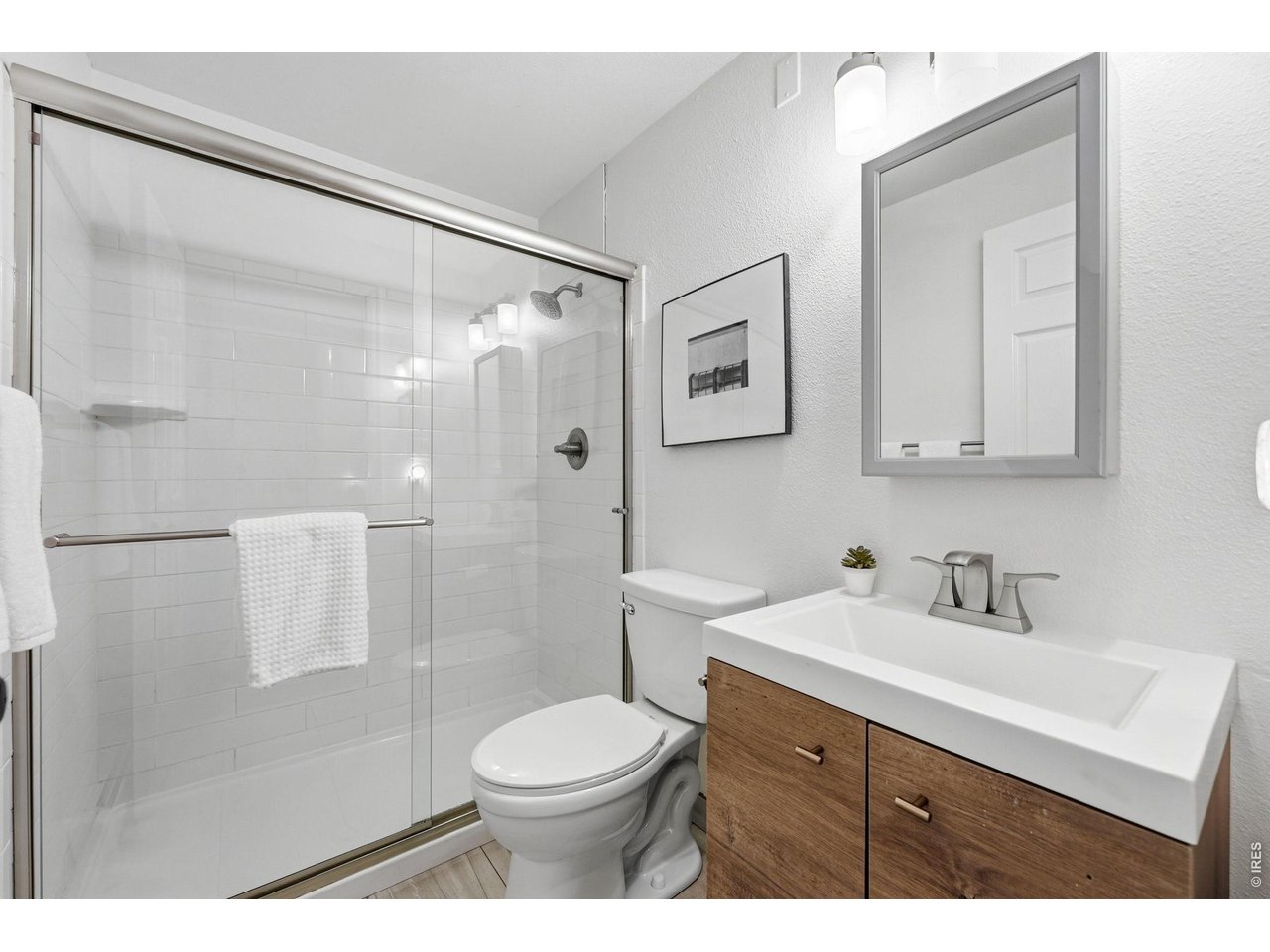 910 Portland Place, Unit 2 Boulder, CO 80304 - Photo 8 of 18 a bathroom with a sink a toilet and shower