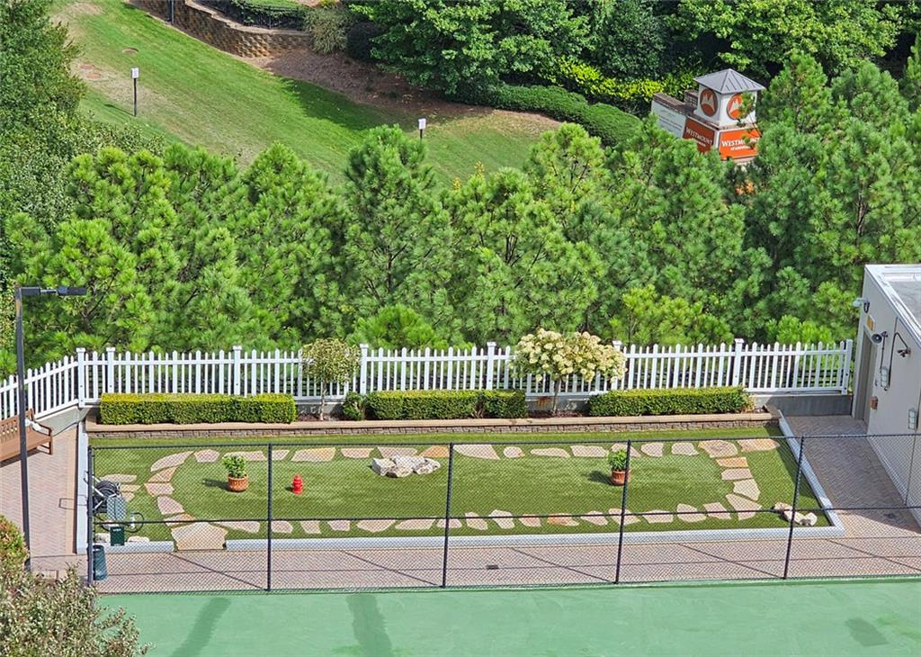 4561 Olde Perimeter Way, Unit 2407 Atlanta, GA 30346 - Photo 19 of 40 a view of a wooden deck with a yard