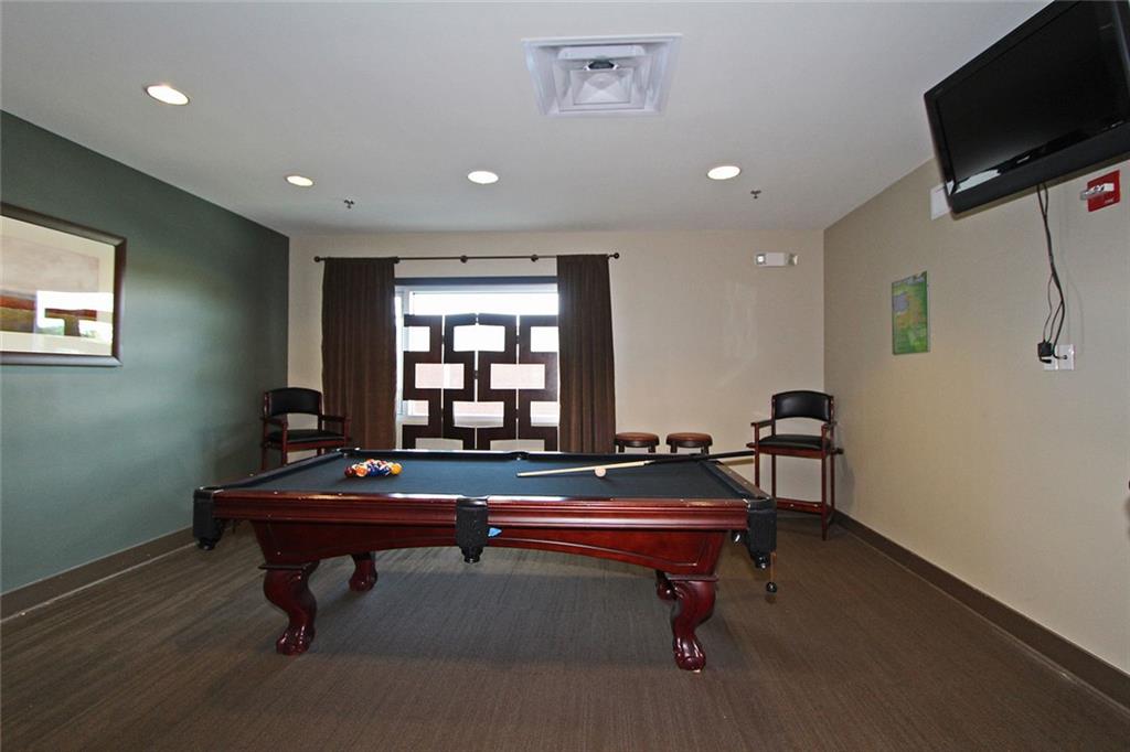 4561 Olde Perimeter Way, Unit 2407 Atlanta, GA 30346 - Photo 28 of 40 a room with furniture pool table and windows