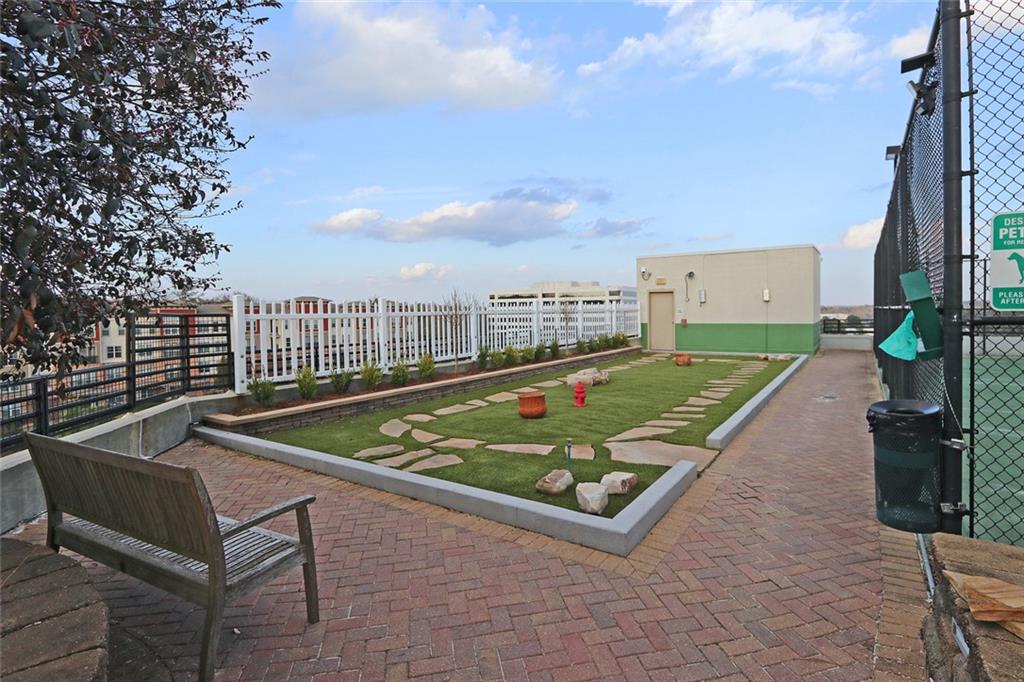4561 Olde Perimeter Way, Unit 2407 Atlanta, GA 30346 - Photo 38 of 40 an outdoor space with lounge chair