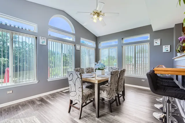 a view of a dining room with furniture window and outside view