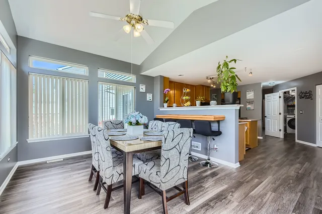 a view of a dining room with furniture window and wooden floor