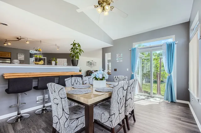 a view of a dining room with furniture window and wooden floor