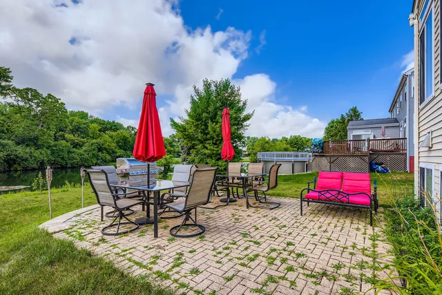 a view of a backyard with sitting area and furniture