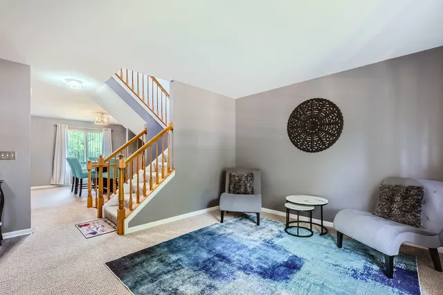 a living room with furniture and a rug