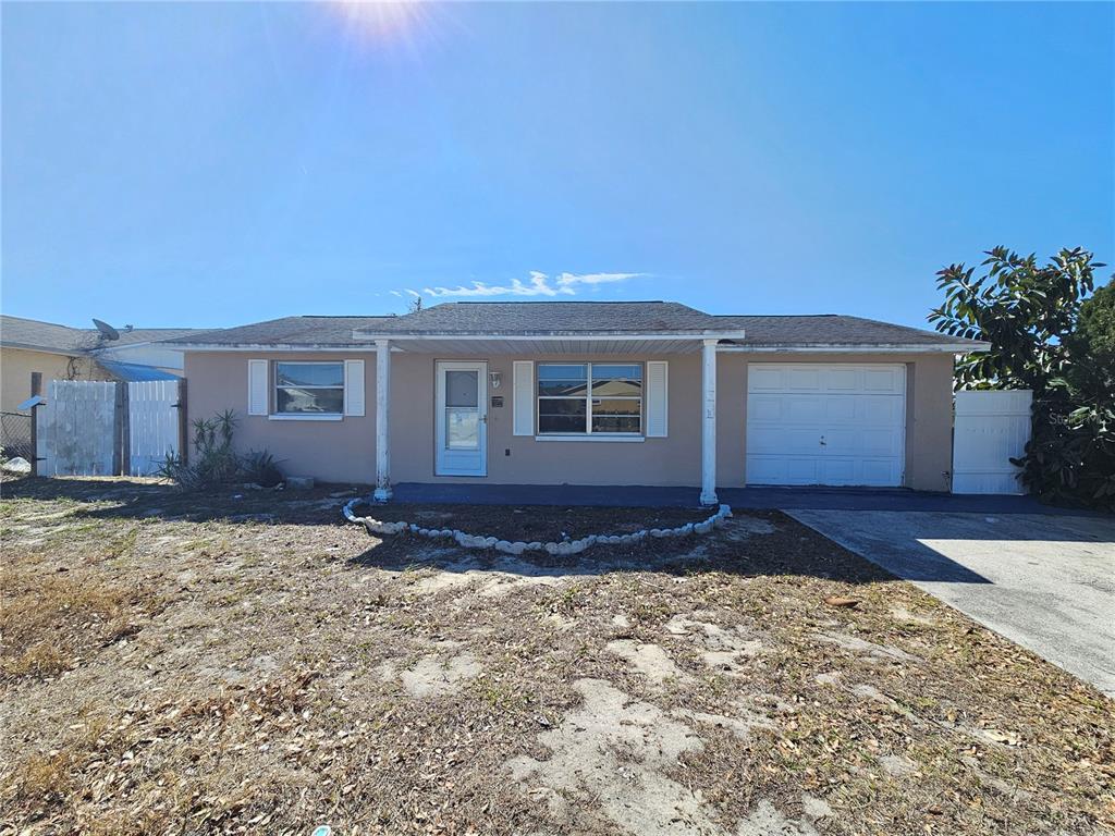 6324 Lomand Avenue New Port Richey, FL 34653 - Photo 1 of 16 a view of a house with a yard
