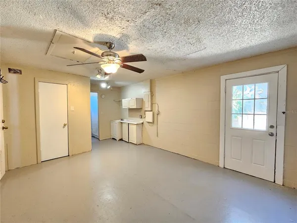 a white toilet and shower sitting next to a bathroom sink