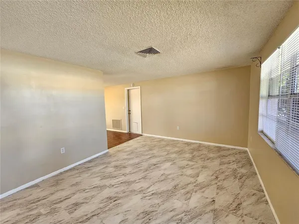 a view of an empty room and window
