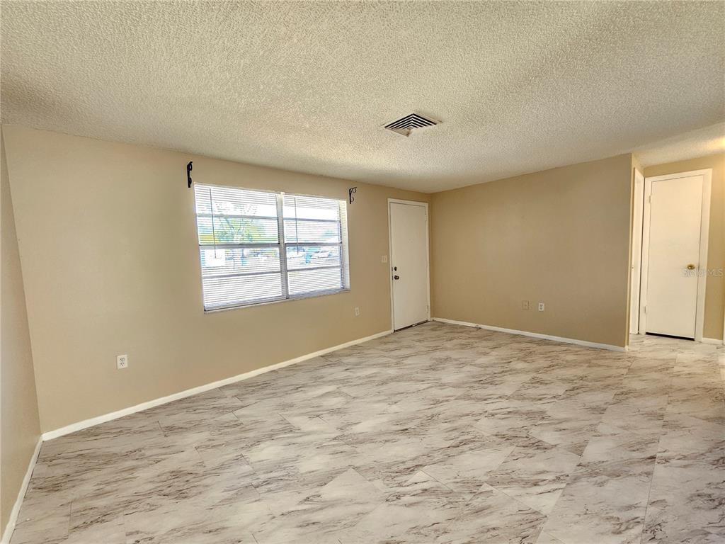 6324 Lomand Avenue New Port Richey, FL 34653 - Photo 3 of 16 a view of empty room with windows