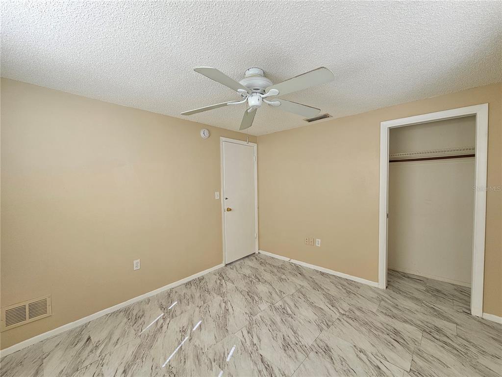 6324 Lomand Avenue New Port Richey, FL 34653 - Photo 8 of 16 wooden floor in an empty room