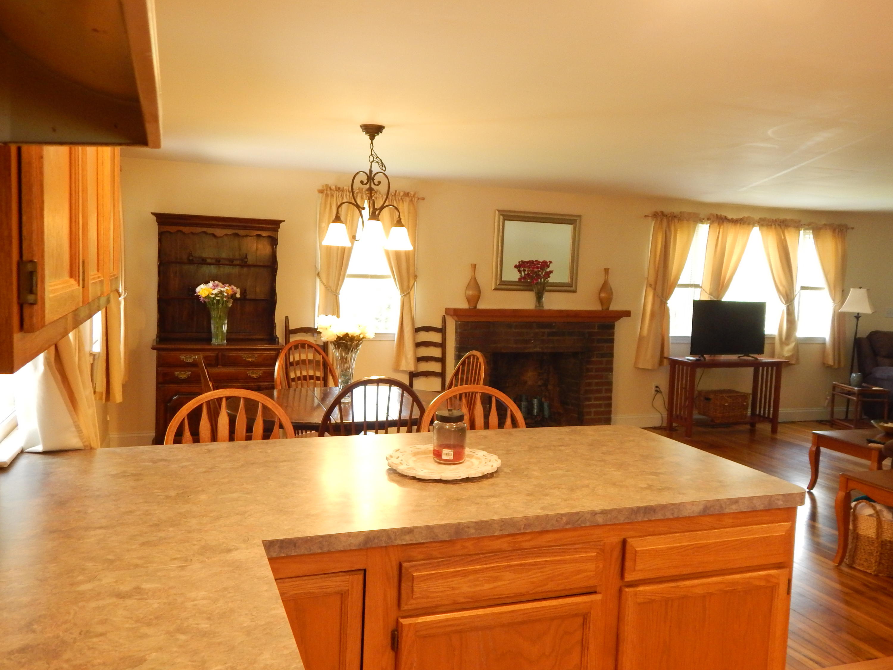 267 Lincoln Road Hyannis, MA 02601 - Photo 12 of 30 a kitchen with a sink and a refrigerator