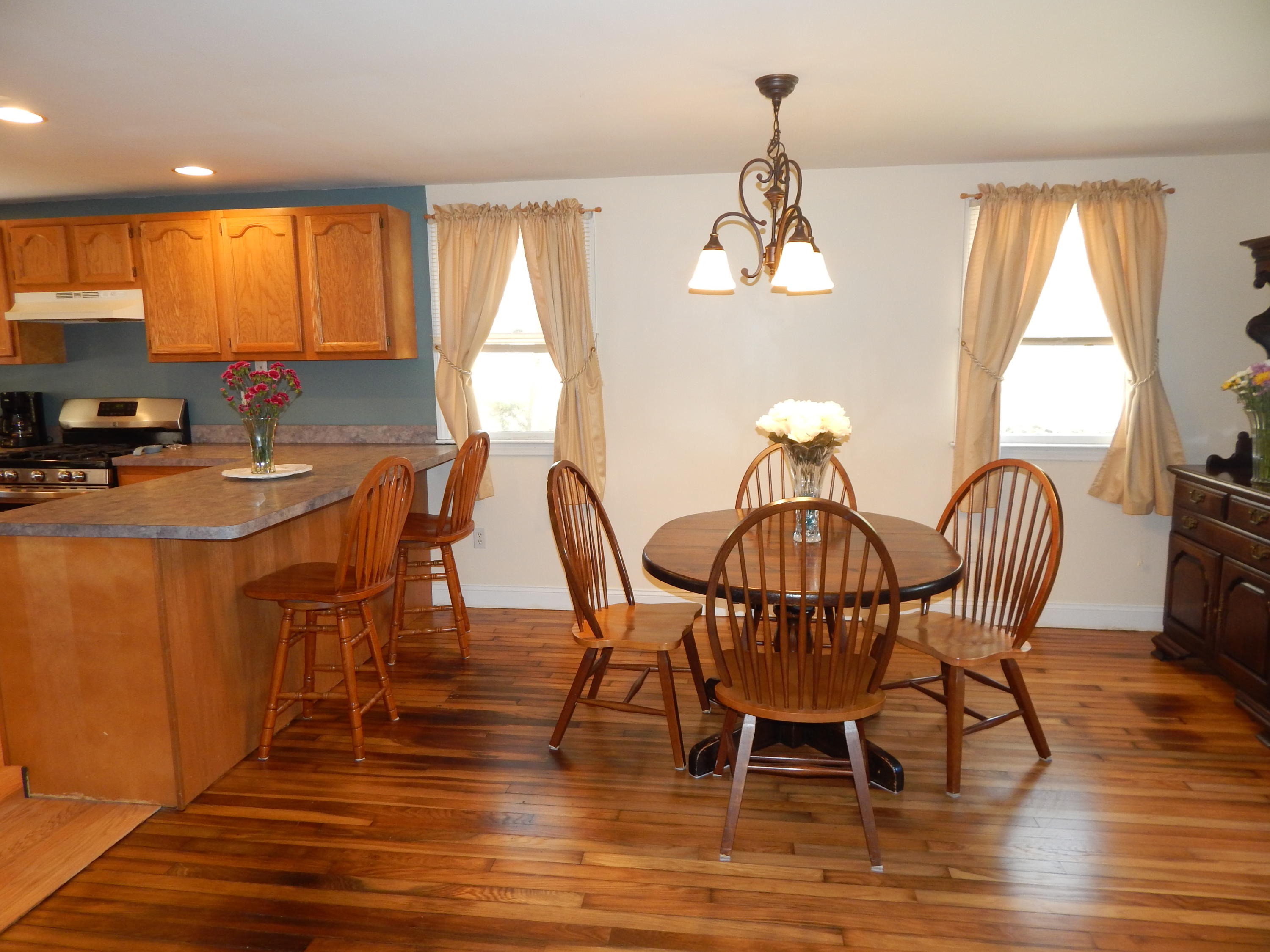 267 Lincoln Road Hyannis, MA 02601 - Photo 13 of 30 a view of a dining room with furniture window and wooden floor