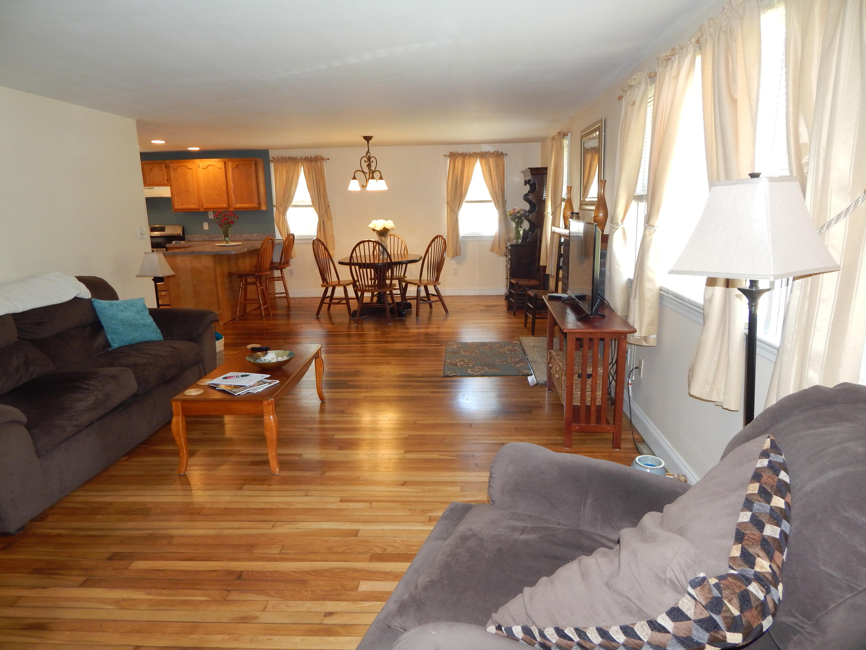 267 Lincoln Road Hyannis, MA 02601 - Photo 14 of 30 a living room with fireplace furniture and floor to ceiling windows