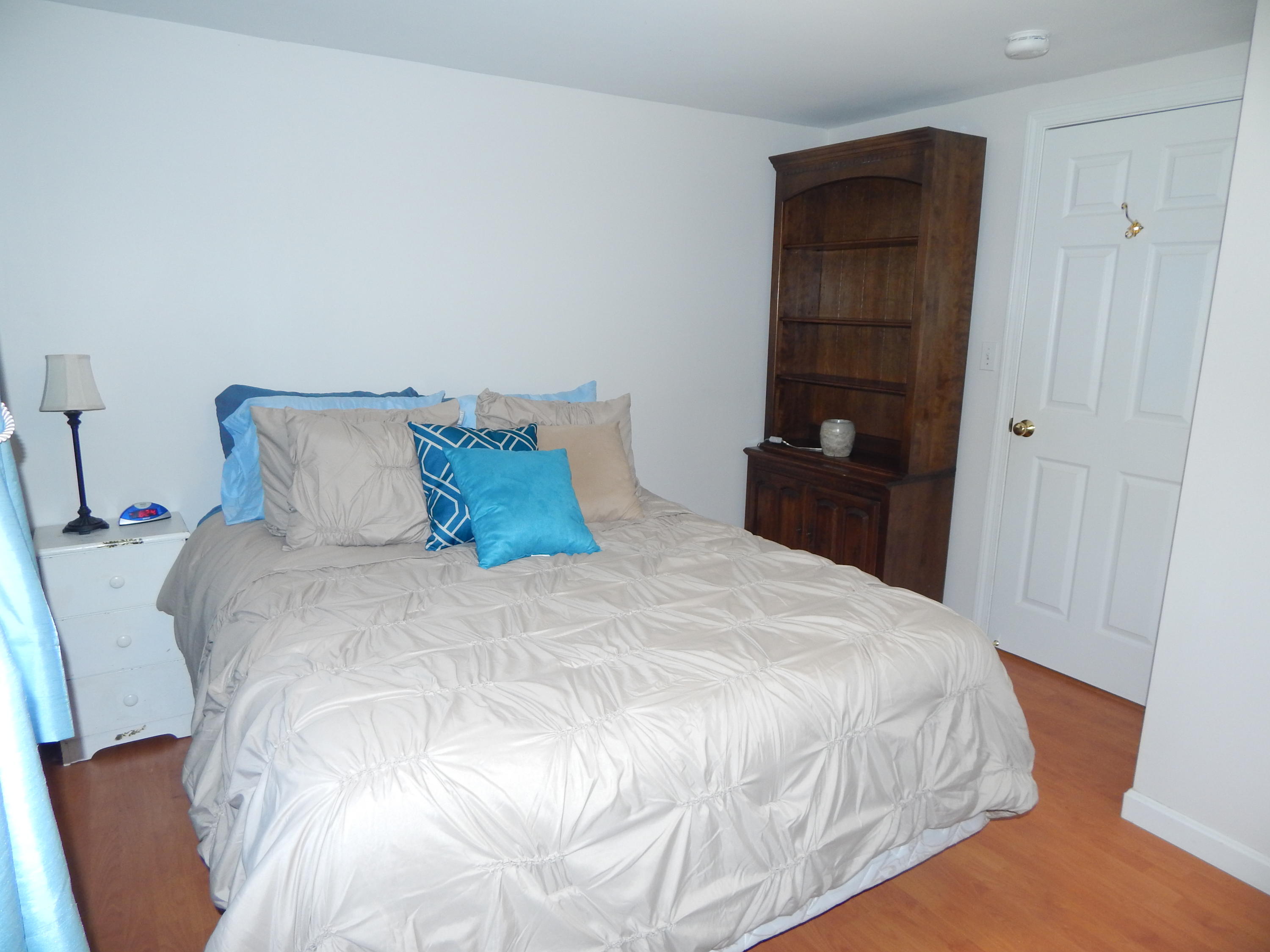 267 Lincoln Road Hyannis, MA 02601 - Photo 19 of 30 a large bed sitting in a bedroom and closet