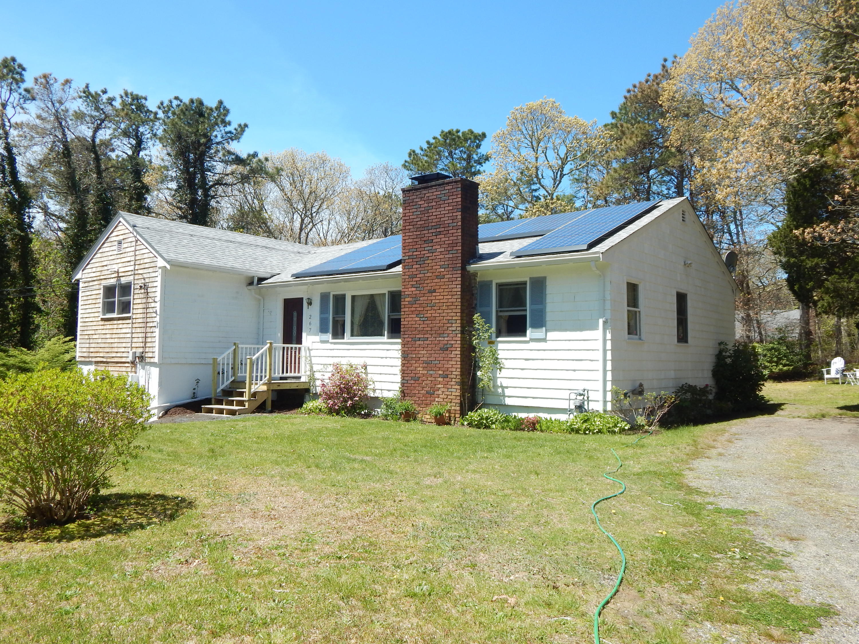 267 Lincoln Road Hyannis, MA 02601 - Photo 2 of 30 a front view of a house with a yard
