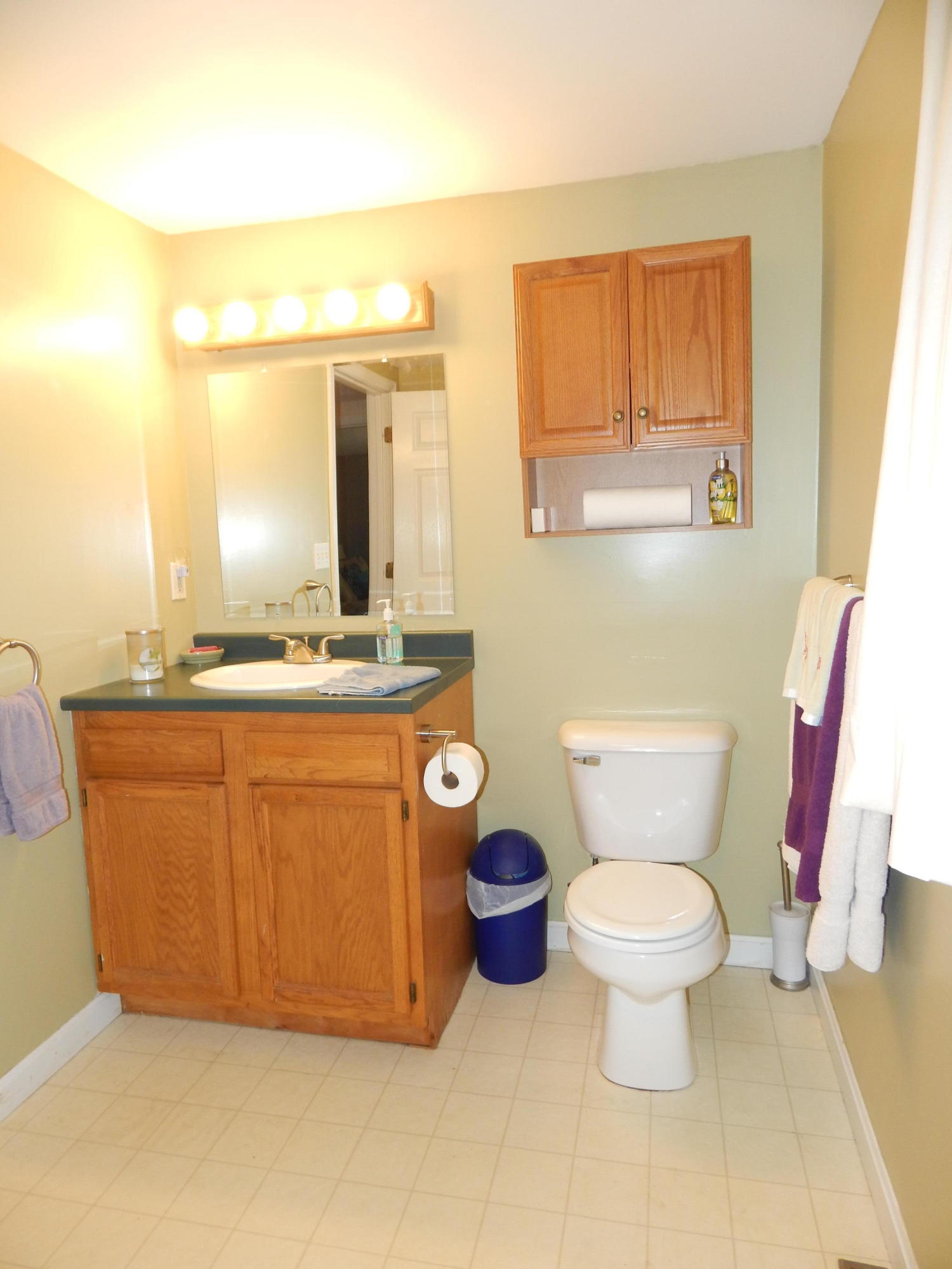 267 Lincoln Road Hyannis, MA 02601 - Photo 21 of 30 a bathroom with a granite countertop toilet sink and mirror