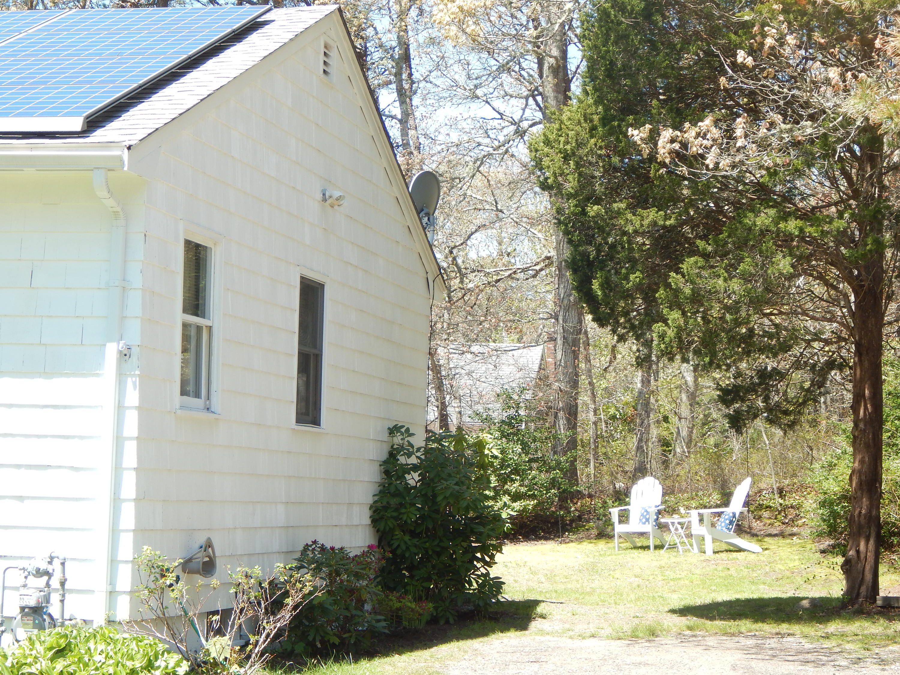 267 Lincoln Road Hyannis, MA 02601 - Photo 3 of 30 a view of a patio with table and chairs and potted plants