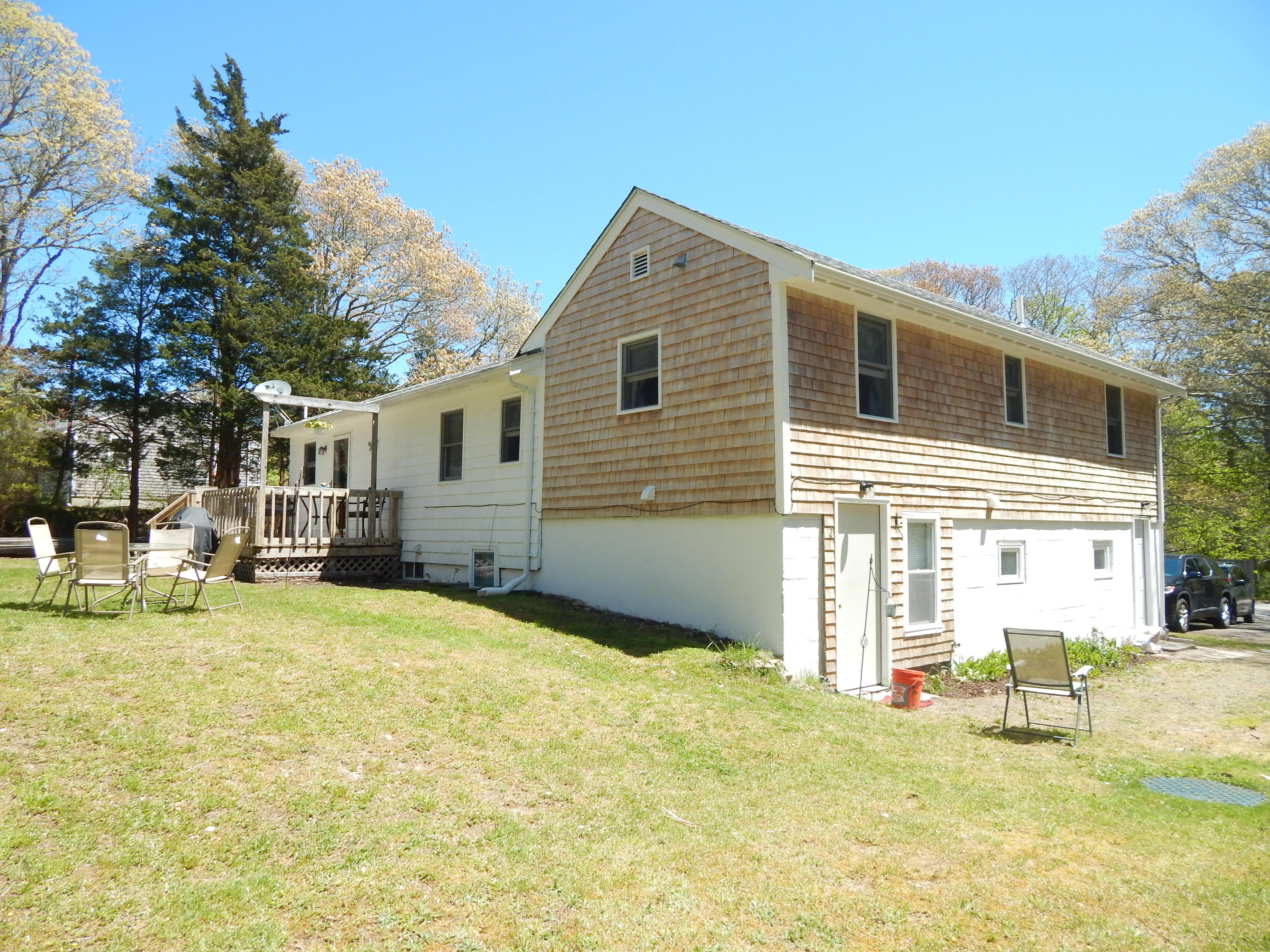 267 Lincoln Road Hyannis, MA 02601 - Photo 6 of 30 a backyard of a house with table and chairs