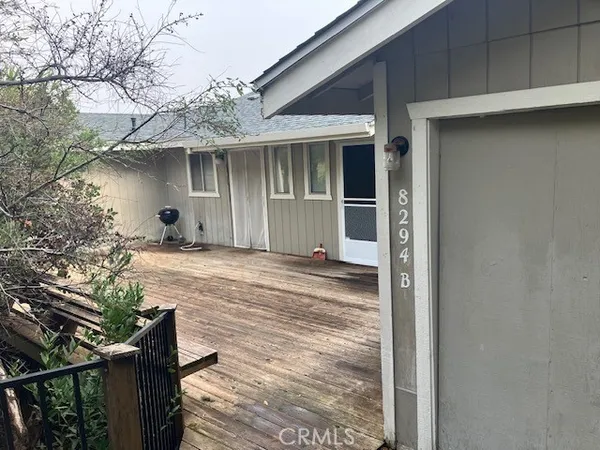 a house with trees in the background