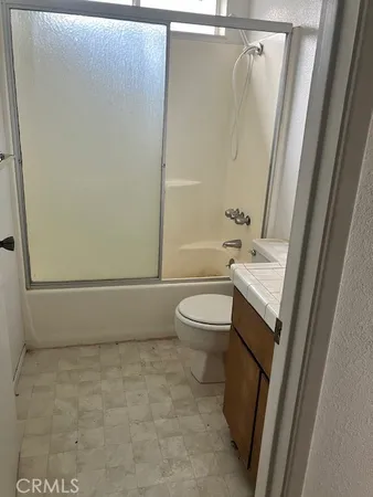 a view of an empty room with a fireplace