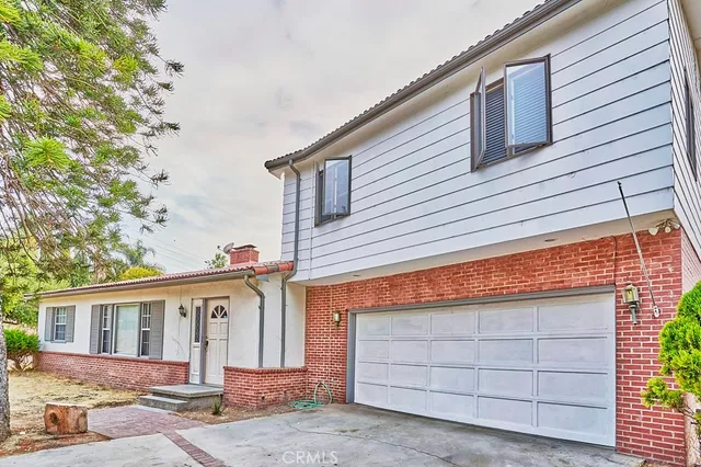 a front view of a house with a garage
