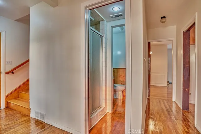 a view of a bathroom from a hallway