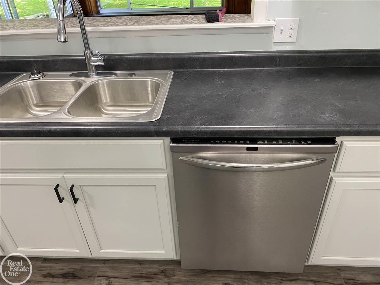 50130 Cedargrove Road Utica, MI 48317 - Photo 15 of 34 Stainless steel appliances and sink