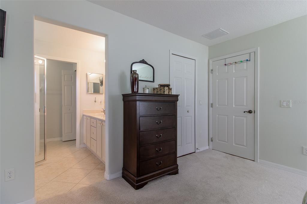 15691 Southwest 11th Court Road Ocala, FL 34473 - Photo 18 of 37 a view of a cabinet and mirror in a room