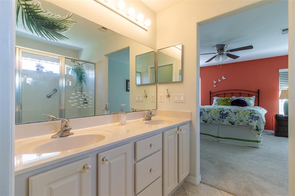 15691 Southwest 11th Court Road Ocala, FL 34473 - Photo 21 of 37 a en suite bathroom with a sink and a mirror