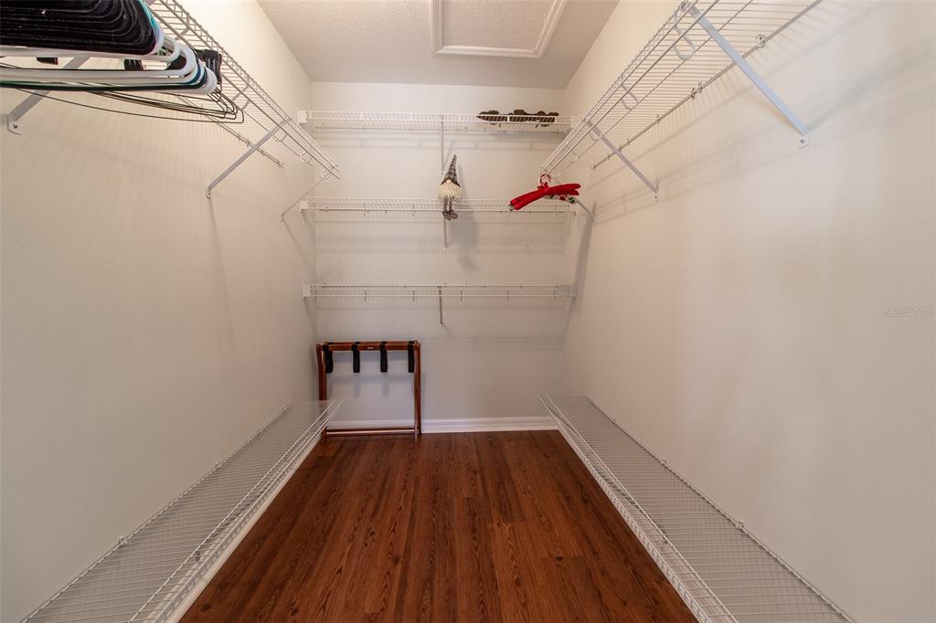 15691 Southwest 11th Court Road Ocala, FL 34473 - Photo 22 of 37 a view of a room with wooden floor and white walls