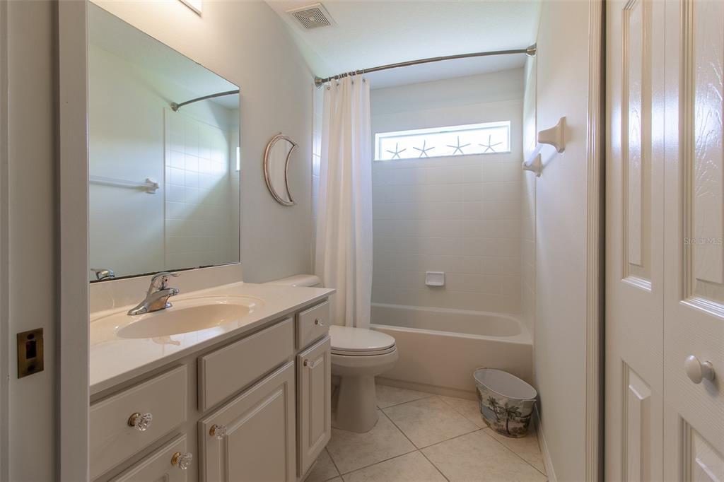 15691 Southwest 11th Court Road Ocala, FL 34473 - Photo 25 of 37 a bathroom with a sink a toilet and shower