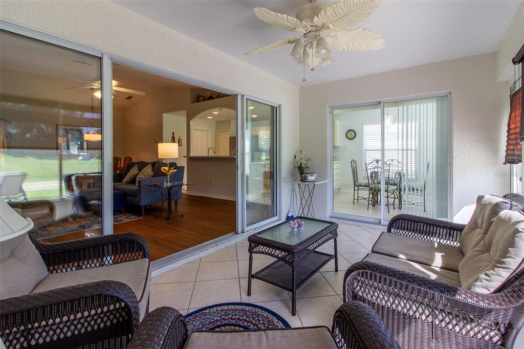 15691 Southwest 11th Court Road Ocala, FL 34473 - Photo 28 of 37 a living room with furniture and a chandelier